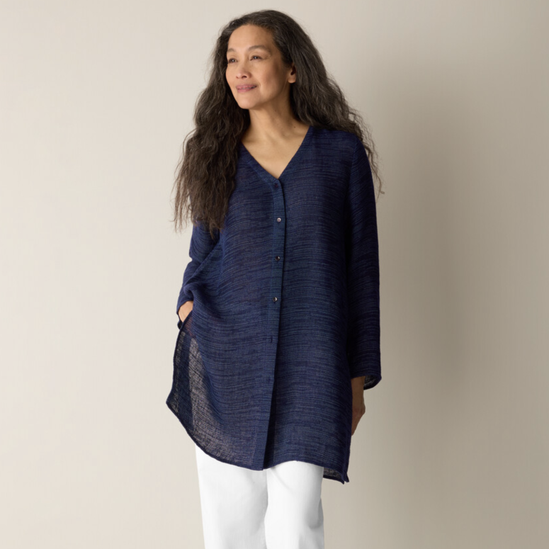 A woman posed in Eileen Fisher clothing